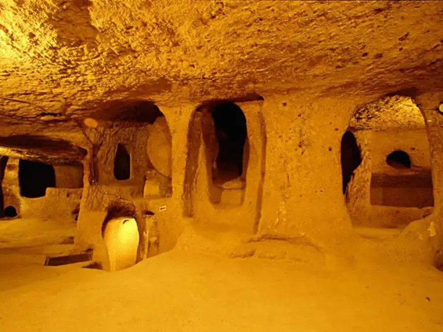 a cave with many holes and a light